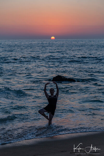 Ballerina standing in ocean Kyle Adler